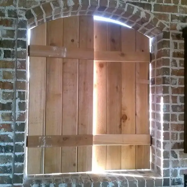 Arched folding cedar shutters